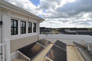 An optimally designed solar panel array brings the home from a low-energy use home to a zero-energy home.
