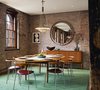 Light and open vintage furnishings contrast with the industrial character of the space. Photo 10 of Tribeca Loft modern home