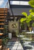 A 150 square-foot glass roof retracts to provide access to the roof and to create an open exterior court at the mezzanine. Photo 3 of Tribeca Loft modern home