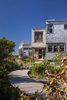 Modern home with Exterior, House Building Type, and Metal Roof Material. In response to the site’s coastal environment, exterior materials are untreated, allowing them to patina over time. Photo 3 of Meadow Beach House