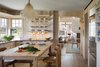 Modern home with Kitchen, Light Hardwood Floor, and Wood Cabinet. The home plays on woods in neutral tones, soft greys, and pale whites to respond to the ever-changing Vineyard light. Photo 8 of Meadow Beach House
