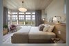 Modern home with Bedroom, Bed, Wall Lighting, and Pendant Lighting. Bolder finishes on the main floor give way to receding hues and fabrics upstairs, connecting to the meadow beyond. Photo 13 of Meadow Beach House