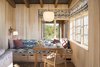 Modern home with Dining Room, Rug Floor, Table, Pendant Lighting, Wall Lighting, Chair, Medium Hardwood Floor, and Bench. Plenty of nooks and alcoves provide intimate spaces within a relatively large house. Photo 11 of Meadow Beach House