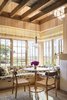 Modern home with Living Room, Pendant Lighting, and Bench. Wrap around corner windows enhance ventilation and connections to the landscape. Photo 9 of Meadow Beach House