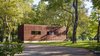 Modern home with Exterior, House Building Type, Wood Siding Material, Flat RoofLine, and Cabin Building Type. photography by Leonid Furmansky Architectural Photography Photo 4 of Lake Austin Cabin