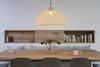 Modern home with Dining Room, Chair, Pendant Lighting, and Table. This casual eating area in the kitchen features a built-in bench and shelf. Photo 7 of Slatted Beach Retreat