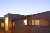 Modern home with Exterior, Wood Siding Material, and House Building Type. The Sea Ranch-inspired home will weather gracefully over time. Photo 14 of Slatted Beach Retreat