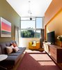 Modern home with Concrete Counter, Recessed Lighting, Wood Cabinet, Metal Cabinet, Concrete Floor, Concrete Backsplashe, Accent Lighting, Refrigerator, Wall Oven, Cooktops, Range Hood, Dishwasher, Undermount Sink, Bed, Chair, Track Lighting, and Bedroom. Guest Room Photo 5 of Land Park Residence