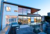 Modern home with Exterior, Concrete Siding Material, Metal Siding Material, Mid-Century Building Type, House Building Type, Shed RoofLine, and Wood Siding Material. The back from the edge of the deck. Photo 4 of Schindler Residence