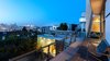 Modern home with Exterior, Wood Siding Material, House Building Type, Flat RoofLine, Glass Siding Material, Mid-Century Building Type, and Concrete Siding Material. The evening view of the glass louvered studio below with the roof deck. Photo 5 of Schindler Residence