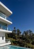 Modern home with Exterior, Stucco Siding Material, Glass Siding Material, House, and Flat RoofLine. Viewing Decks Floating above Pool Photo 19 of Minimal House One