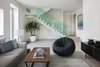 Modern home with Staircase, Wood Tread, Wood Railing, and Glass Railing. Media Room Photo 17 of Minimal House One