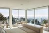 Modern home with Bedroom, Ceiling Lighting, Accent Lighting, Chair, Recessed Lighting, Bed, and Light Hardwood Floor. View from Master Bedroom Photo 11 of Minimal House One