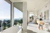 Modern home with Bath Room, Ceiling Lighting, Freestanding Tub, Recessed Lighting, Marble Wall, Accent Lighting, Marble Floor, Undermount Sink, Full Shower, Marble Counter, One Piece Toilet, and Enclosed Shower. Master Bath with a View Photo 12 of Minimal House One