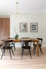 Modern home with Dining Room, Table, Pendant Lighting, and Light Hardwood Floor. Statement dining room light fixture by Lambert et Fils ties together this contemporary design. Photo 2 of Open and Airy Whole-Home Remodel
