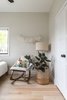 Modern home with Bedroom, Chair, and Light Hardwood Floor. A reading nook with a modern side chair and lamp for the toddler’s bedroom. Perfect for winding down before bedtime. Photo 12 of Open and Airy Whole-Home Remodel