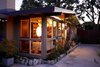 Cliff May signature features include clerestory windows, floor-to-ceiling windows and doors, board & batten siding, wide eaves, and post and beam construction. Photo 3 of Kallin Rancho modern home