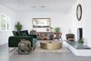 Modern home with Living Room, Wood Burning Fireplace, Chair, Sofa, Gas Burning Fireplace, Recessed Lighting, Coffee Tables, End Tables, Console Tables, and Concrete Floor. A clean and crisp interior restored to all its original glory, with a boho twist. Photo 4 of This Palm Springs Gem Gets A Modern Makeover With A Bohemian Twist
