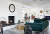 Modern home with Living Room, Coffee Tables, Sofa, Gas Burning Fireplace, and Concrete Floor. The intent of the open concept was for their family to be able to be in different areas of the house but still feel connected. Photo 2 of This Palm Springs Gem Gets A Modern Makeover With A Bohemian Twist
