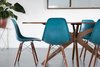Modern home with Dining Room, Concrete Floor, Chair, Table, and Recessed Lighting. Here we see an original mid century table paired with new modern chairs and accented with a bohemian pot and side table. Photo 7 of This Palm Springs Gem Gets A Modern Makeover With A Bohemian Twist