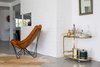 Modern home with Living Room, Chair, Recessed Lighting, End Tables, and Ceiling Lighting. Accessorizing with both new and vintage furniture adds to the eclectic character. Photo 18 of This Palm Springs Gem Gets A Modern Makeover With A Bohemian Twist
