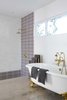 Modern home with Bath Room, Mosaic Tile Wall, Open Shower, Freestanding Tub, Ceiling Lighting, Recessed Lighting, Soaking Tub, and Concrete Floor. Custom Moroccan mosaic tile and brass hardware showcase the homeowner's bohemian flare to traditional midcentury style. Photo 10 of This Palm Springs Gem Gets A Modern Makeover With A Bohemian Twist