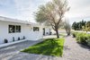 Modern home with Exterior, House Building Type, and Mid-Century Building Type. This sprawling ranch style home is drenched in California sunlight around the clock. A fresh coat of whitewash paint keeps it true to its original nature. Photo 16 of This Palm Springs Gem Gets A Modern Makeover With A Bohemian Twist