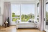 Modern home with Bedroom. A beautiful daybed in the master bedroom boasts a second story view of the expansive five acres of land and Mount Pinnacle. Photo 8 of Light Filled House For Ten