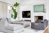 Modern home with Living Room. The designer created a family room is cozy enough for the family to all relax together, but still polished and modern. Photo 5 of Light Filled House For Ten