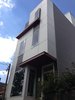 In reference to the context, the fenestration of the window openings complements others typical of this neighborhood, while a large picture window in the front room and double glass doors to the first floor terrace channel ample light into the structure. Photo of Charlotte Street Residence modern home