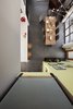 The house interior combines the best of a loft-like industrial space with the comforts of a single-family home. The home is centered upon nature’s golden-ratio proportioned, two-story living space. Photo of Lola House modern home