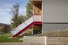 Lola House is a modern interpretation of the typical Lawrenceville home with simple, straightforward massing built onto the unique hillside, a feature that allows to a break from the row house typology of the street. Photo 3 of Lola House modern home