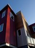 The project site is surrounded by a mix of uses that comprise the residential/commercial corridor. The isolation of the triangular island allowed for a more contemporary palette and articulation, while maintaining massing and density appropriate to the adjacent historic working class neighborhood. Photo 6 of Croghan's Edge Townhomes modern home