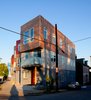 The Croghan’s Edge Townhouse project addressed a difficult infill challenge in Pittsburgh’s dense urban Lawrenceville neighborhood. The challenge was to accommodate four distinct for-sale residences on a small triangular site of only 3,300 square feet in an area that is surrounded by two streets and an alley. Additionally, the developer’s intent and desire was to use factory-built modular components for the upper stories. The solution was to develop a scheme that not only addressed the neighborhood row house scale, but also provided a contemporary interpretation of the neighborhood context. Our design turned the site problems into opportunities for a unique solution. Photo 4 of Croghan's Edge Townhomes modern home