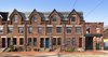The repetitive beauty of the existing brick facades were maintained and serve as a strong unify element of the whole redevelopment. Photo 3 of 48th Street Row modern home
