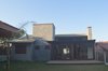 Modern home with Exterior, House Building Type, Shingles Roof Material, and Stone Siding Material. Facade Photo 2 of Fontana's home