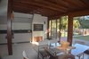 Modern home with Dining Room, Table, Stools, Wood Burning Fireplace, Ceramic Tile Floor, Ceiling Lighting, Pendant Lighting, Chair, and Storage. barbecue grill Photo of Fontana's home