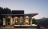 The house offers beautiful mountain and lake views. Photo of Lakeside Cottage modern home