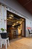 Aluminum roll up door extends the living space outdoors. Photo 4 of Lakeside Cottage modern home
