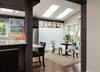 We call it the morning room now. Skylights, improved windows and lighting contribute to a comfortable place to be. Opening up walls ties this room to kitchen and living spaces making a wonderful place for entertaining. Photo 3 of The Ping Pong Home modern home