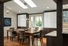 Our design was planned to "fit" a ping pong table, but it was the homeowners who found this awesome combination ping pong table/dining table which looks great and works very well in the space. The light fixture over the table moves up and out of way during play time. The angled window seat was part of the original architecture, but we added storage below, expanded the seat, and flanked the area with generous and attractive storage. Photo 5 of The Ping Pong Home modern home