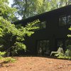 Modern home with Exterior, House Building Type, Mid-Century Building Type, Brick Siding Material, Shingles Roof Material, and Wood Siding Material. Spring/Summer - 2018 (renovation + landscaping still in progress) Photo 2 of Mid-Century Life Crisis