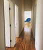 Modern home with Hallway and Light Hardwood Floor. Hallway to bedrooms (newly renovated) - View 2 Photo 8 of Mid-Century Life Crisis
