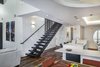 The stair design came from homeowner Robert Mockley, who wanted something he had never seen before. He suggested different size bars spaced at different uneven locations to give the railing a unique look. Photo 8 of Collier Residence modern home