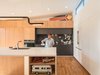 Grohe kitchen Faucet + Tonka Winnebago toy was inspo for exterior wood siding Photo 7 of The Beach Lab modern home