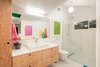 A floating Doug Fir plywood vanity + Duravit Happy D sink & wall hung toilet Photo 16 of The Beach Lab modern home
