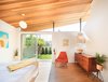 Modern home with Medium Hardwood Floor and Pendant Lighting. Master Bedroom with Western Red Cedar ceiling and clerestory windows that make the roof appear to be floating Photo 14 of Cardiff with A Side of Ranch