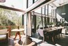The living space continues out onto the deck, flooded also with natural light and a great view. Photo 3 of Eco 234 modern home