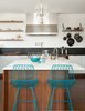 Modern home with Kitchen, Range Hood, Cooktops, Range, Laminate Cabinet, Medium Hardwood Floor, Ceramic Tile Backsplashe, Wood Cabinet, Marble Counter, and Pendant Lighting. close-up of the island in walnut Photo 12 of Glen Park House
