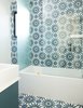 Modern home with Bath Room, Engineered Quartz Counter, Cement Tile Floor, Vessel Sink, Alcove Tub, Corner Shower, and One Piece Toilet. cement tile from Cle from floor to wall in the kids' bathroom Photo 2 of Glen Park House